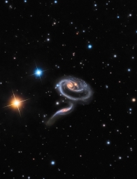 Пара взаимодействующих галактик под общим названием Arp 273, создают образ розы. Расположены они от нас на расстоянии 300 миллио